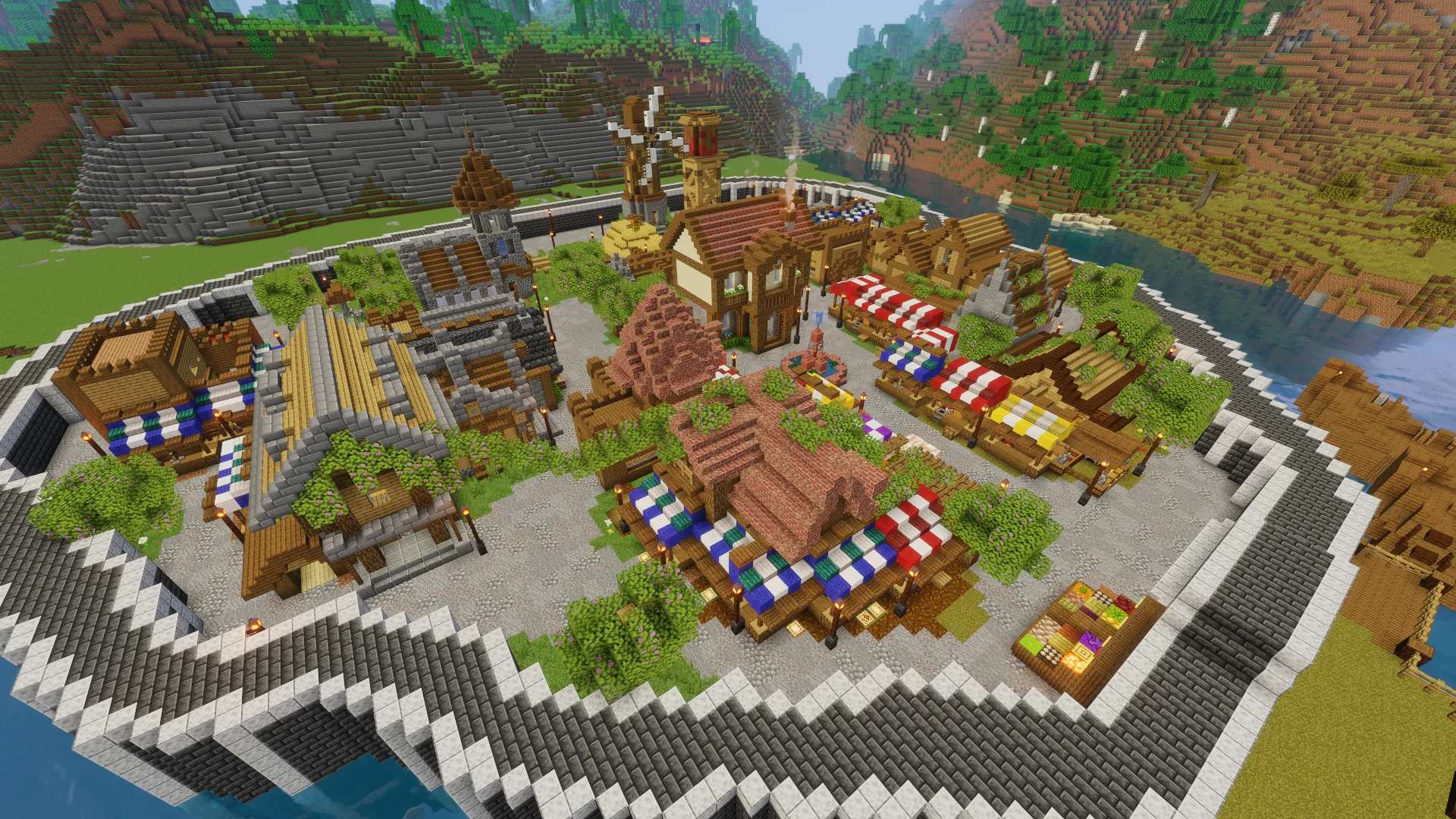 Центр города в Minecraft за кольцевой каменной стеной: кирпичное здание в окружении прилавков, дома и мельница